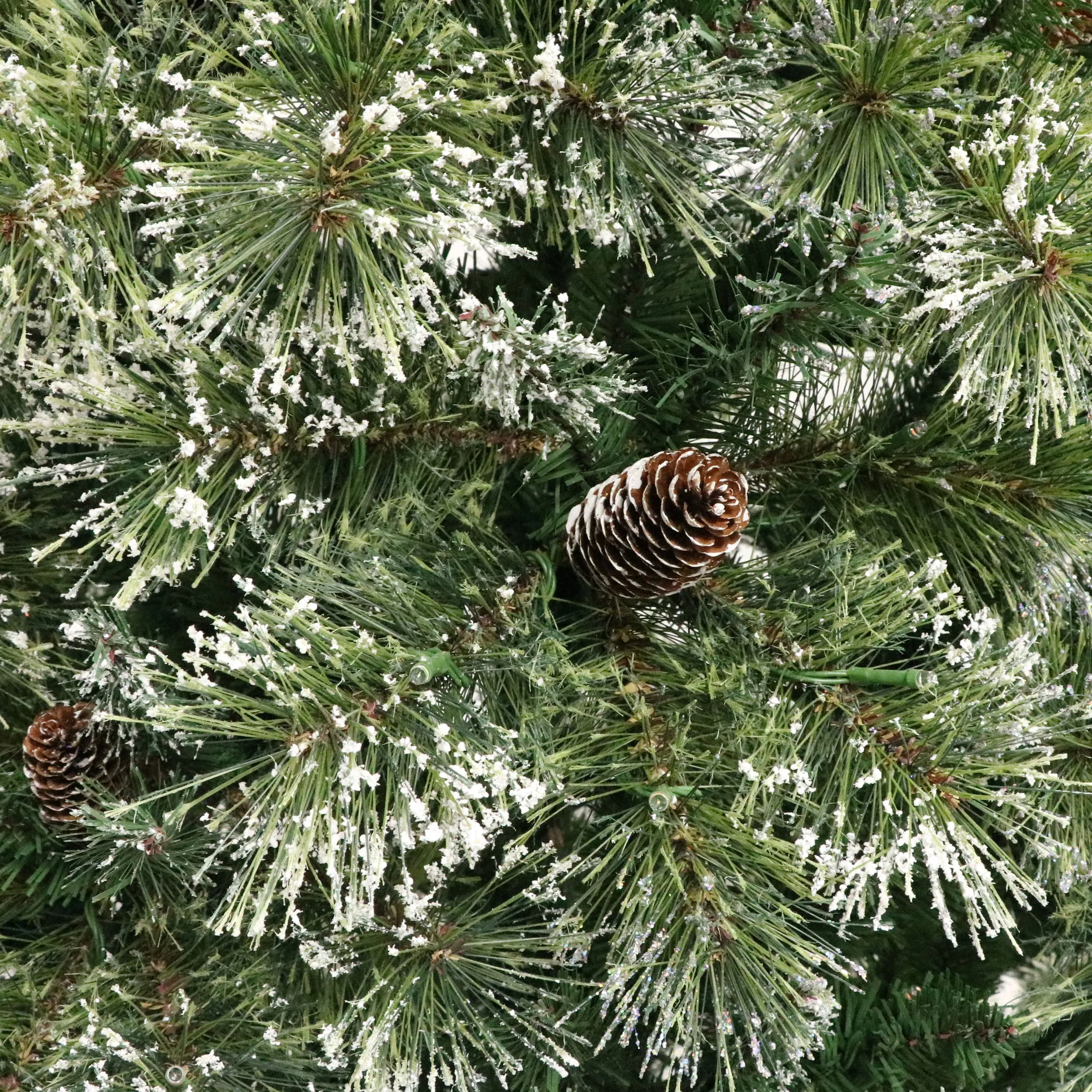 Cashmere Pine and Mixed Needles Pre-Lit Clear LED Hinged Artificial Christmas Tree with Snow and Glitter Branches and Frosted Pinecones - NH812513