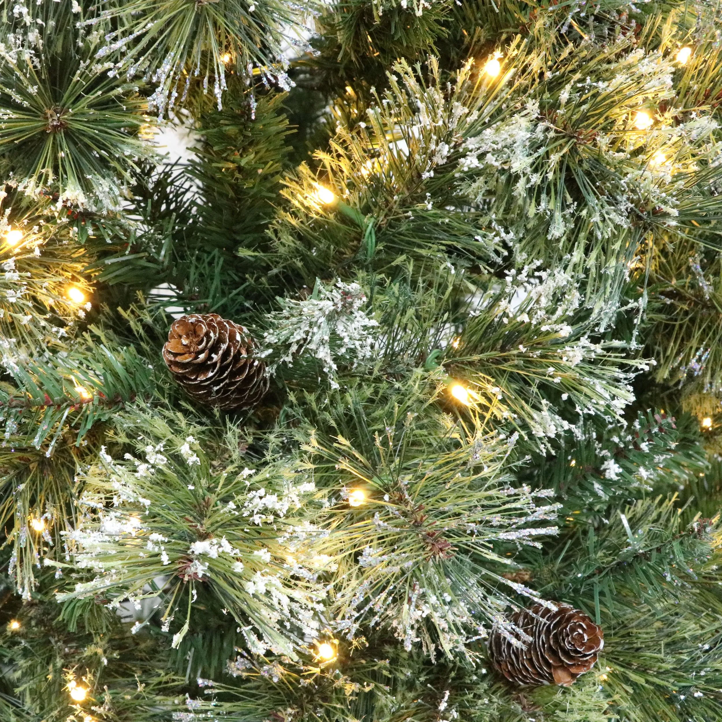 Cashmere Pine and Mixed Needles Pre-Lit Clear LED Hinged Artificial Christmas Tree with Snow and Glitter Branches and Frosted Pinecones - NH812513
